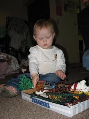 Sarah plays with her new animals.