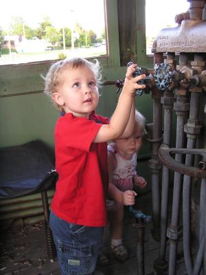 Noah and Sarah on an old engine in Alliance