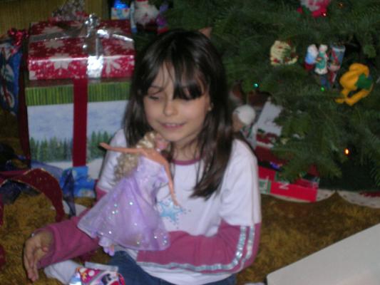 Malia plays with her action figure (doll)