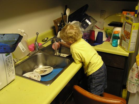Noah washing dishes.