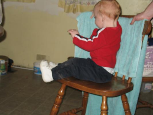 Steven sits on a chair.