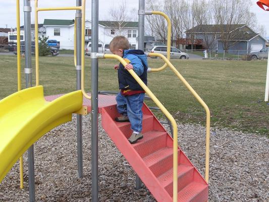 Noah plays at the park before the Easter egg hunt.