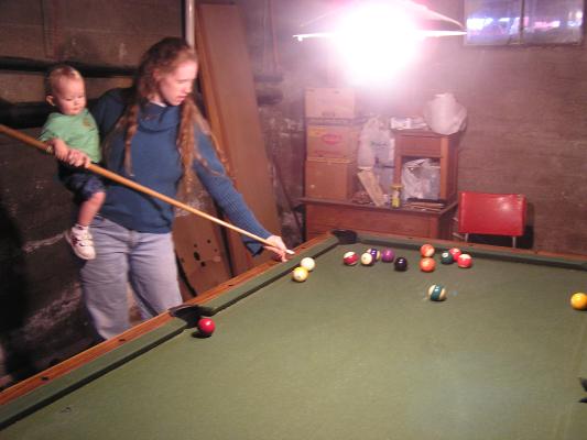 Noah likes to  play pool in his 
great-grandpa's basement.