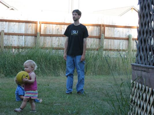 Sarah, Noah and Mike play ball.