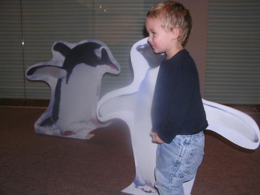 Noah with some penguins at the Museum of the Rockies.