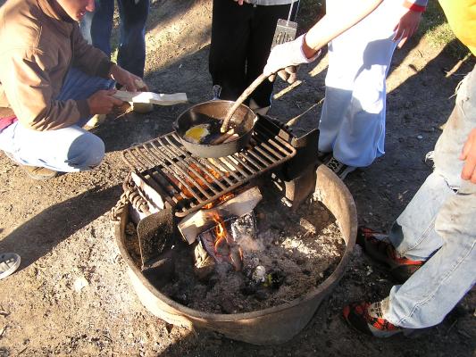 Christian Student Fellowship campout.
Cooking eggs for breakfast.