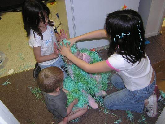 Let's cover Sarah with Easter grass.
