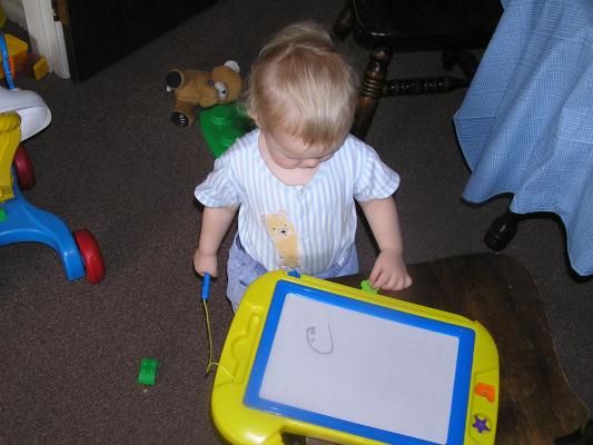 Noah draws on his magnadoodle
