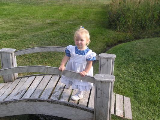 Sarah plays on a little bridge.