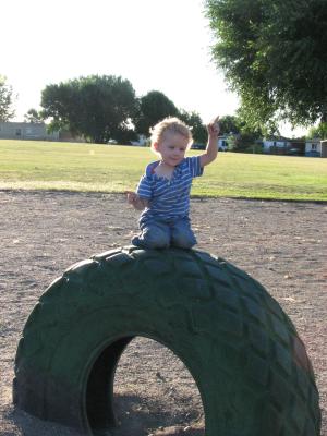 Noah by the green tire