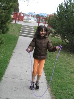 Malia plays with a jumprope.