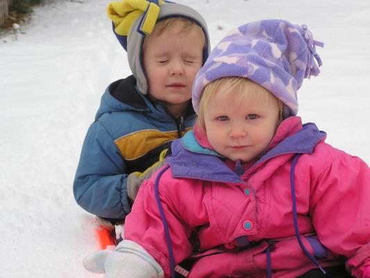 Noah and Sarah ride the sled