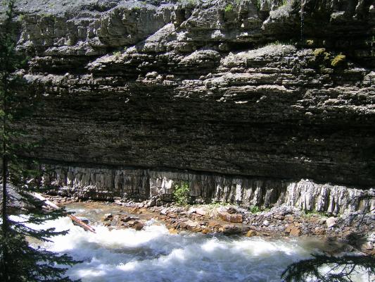 Sedimentary deposits along the bank.