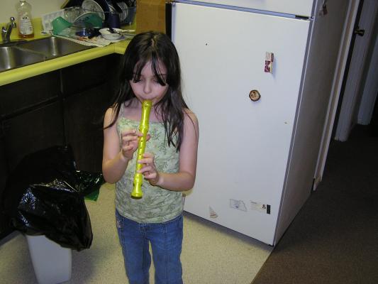 Malia plays with a wistle.