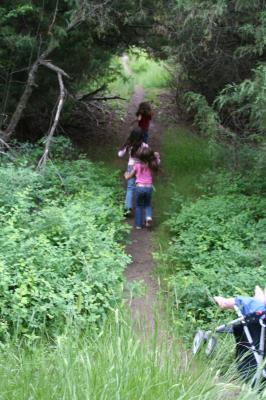 Nicole, Malia and Andrea race down the trail.