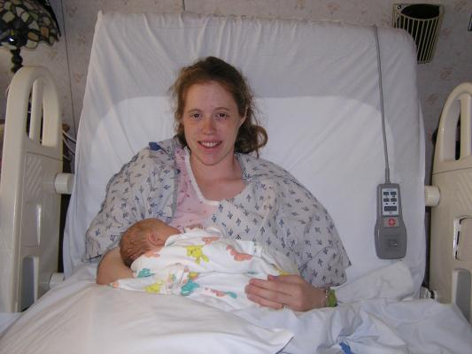 Katie holds her new baby girl.