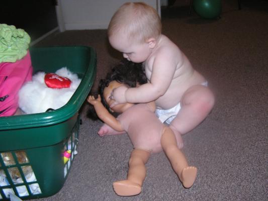 Sarah plays with a doll.