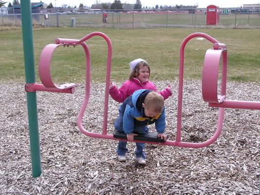 Kids play at the park before the Easter egg hunt.