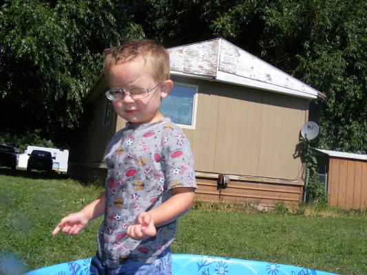 Noah plays in the kiddy pool.