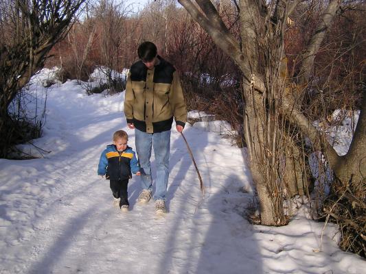 Noah and David on their winter hike in the woods.