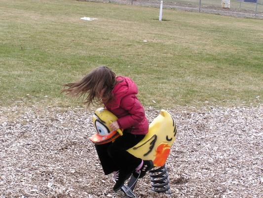 Andrea plays at the park before the Easter Egg hunt.