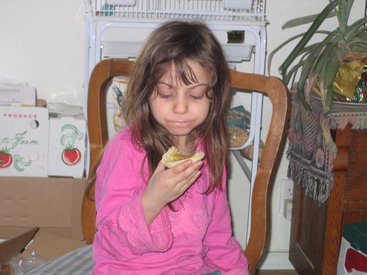 Andrea eats some breakfast.