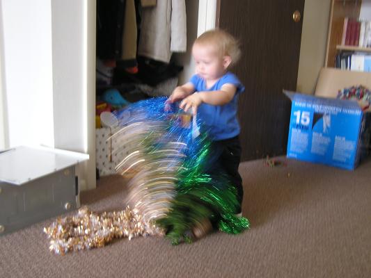 Noah plays with tinsel.