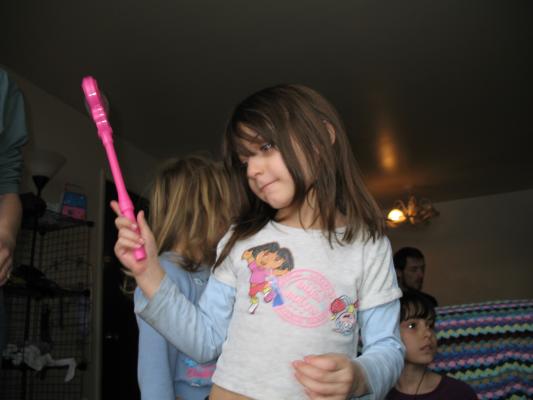 Andrea plays with her new magic wand.