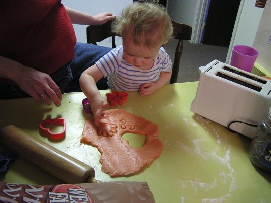Noah cuts out some hands.
