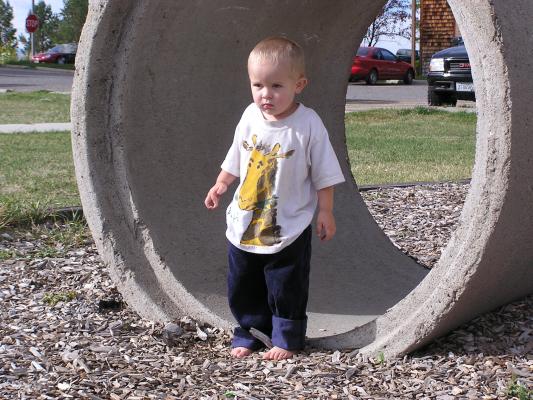 Noah remembers there is a sandbox and is about to make a run for it.