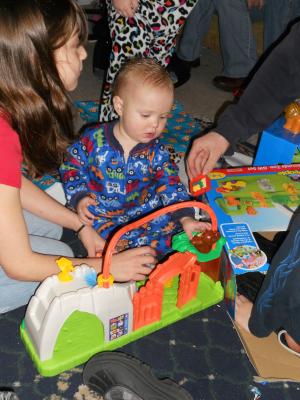 Everyone wants to play, but it is Joshua's new toy. 