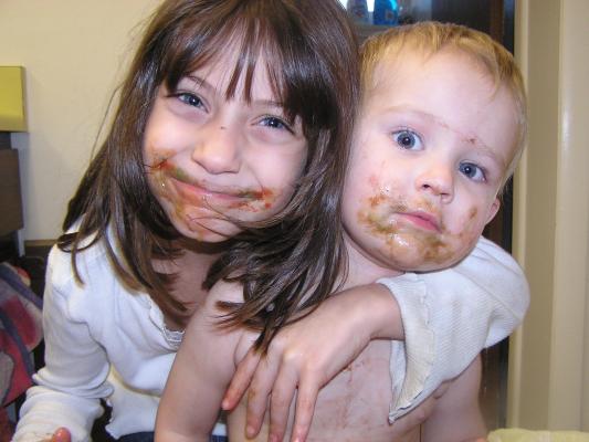 Andrea and Noah with messy faces.
