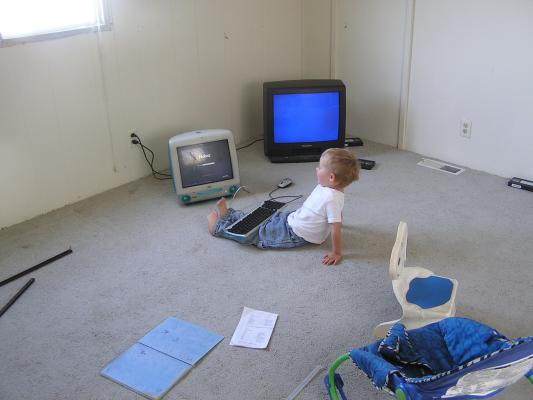 Noah plays computer in the new house