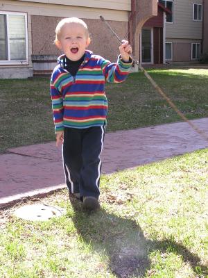 Noah plays with a good stick.