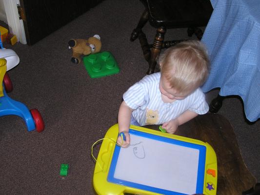 Noah draws on his magnadoodle