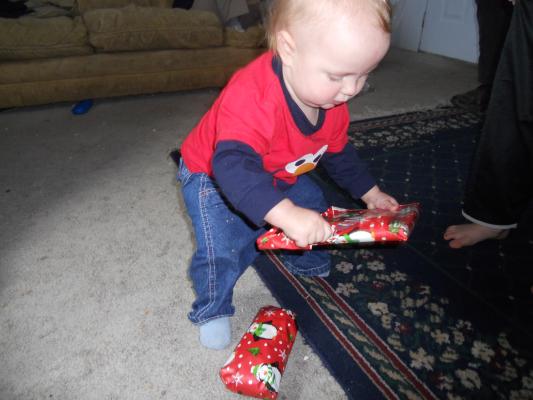 Joshua has more gifts from Mom and Dad. 