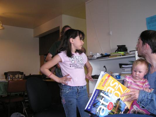 Malia checks out David's new atlas.