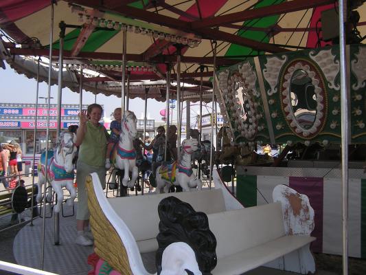 Katie asnd Sarah on the carnival's merry-go-round