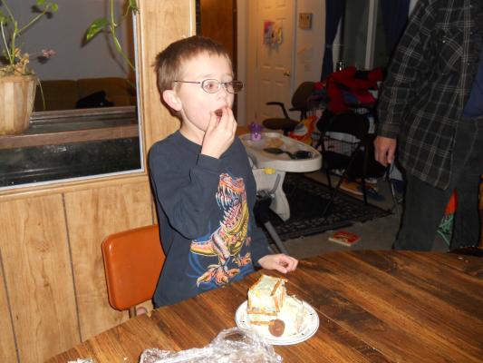 Noah eats birthday cake. 
