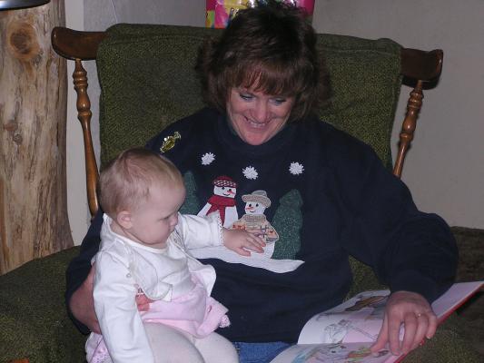 Sheley reads to Sarah.