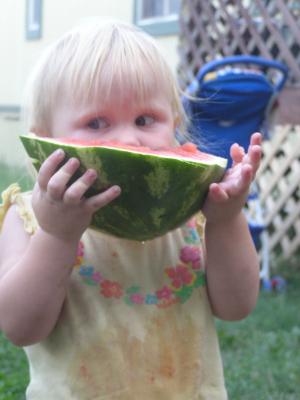 Sarah eats some watermelon.