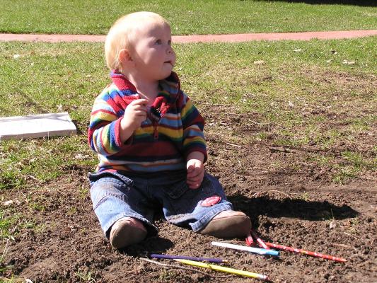 Sarah plays in the dirt.