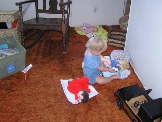 Sarah caring for baby dolls