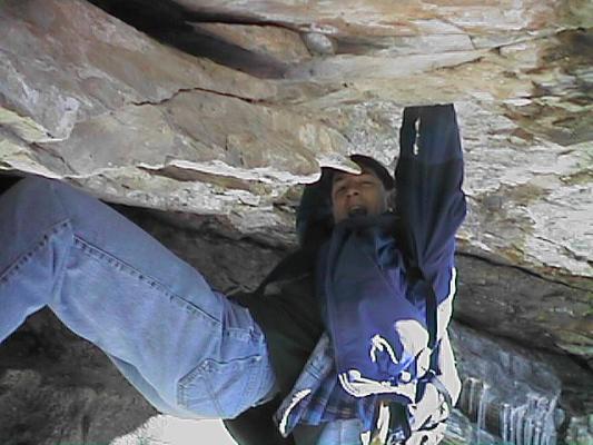 David hangs from a rock.