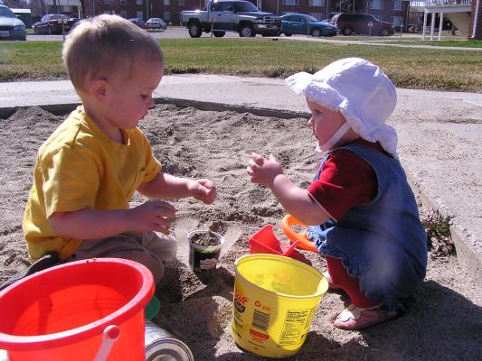Noah and Sarah play in the sand