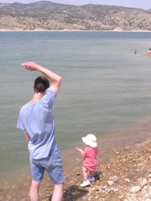 David and Sarah throw rocks into Ruby Reservoir