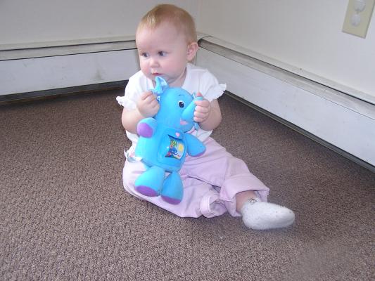 Sarah plays with her new elephant.