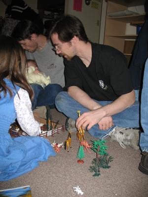 The kids play with animals.