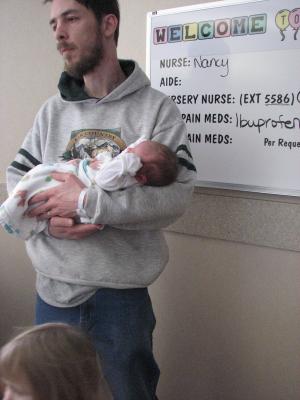 David holds the baby.