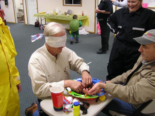 GVCC Fall Party - Bill looks for pennies.